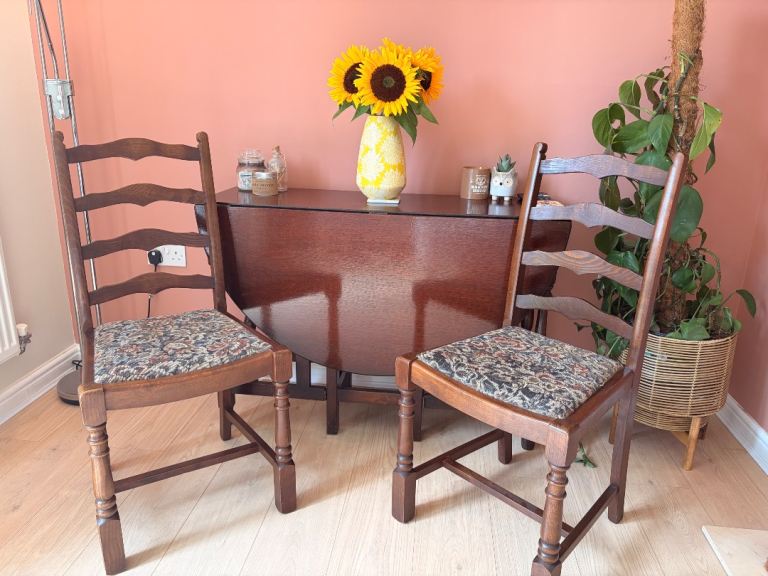 Antique solid oak drop leaf dining table and chairs 