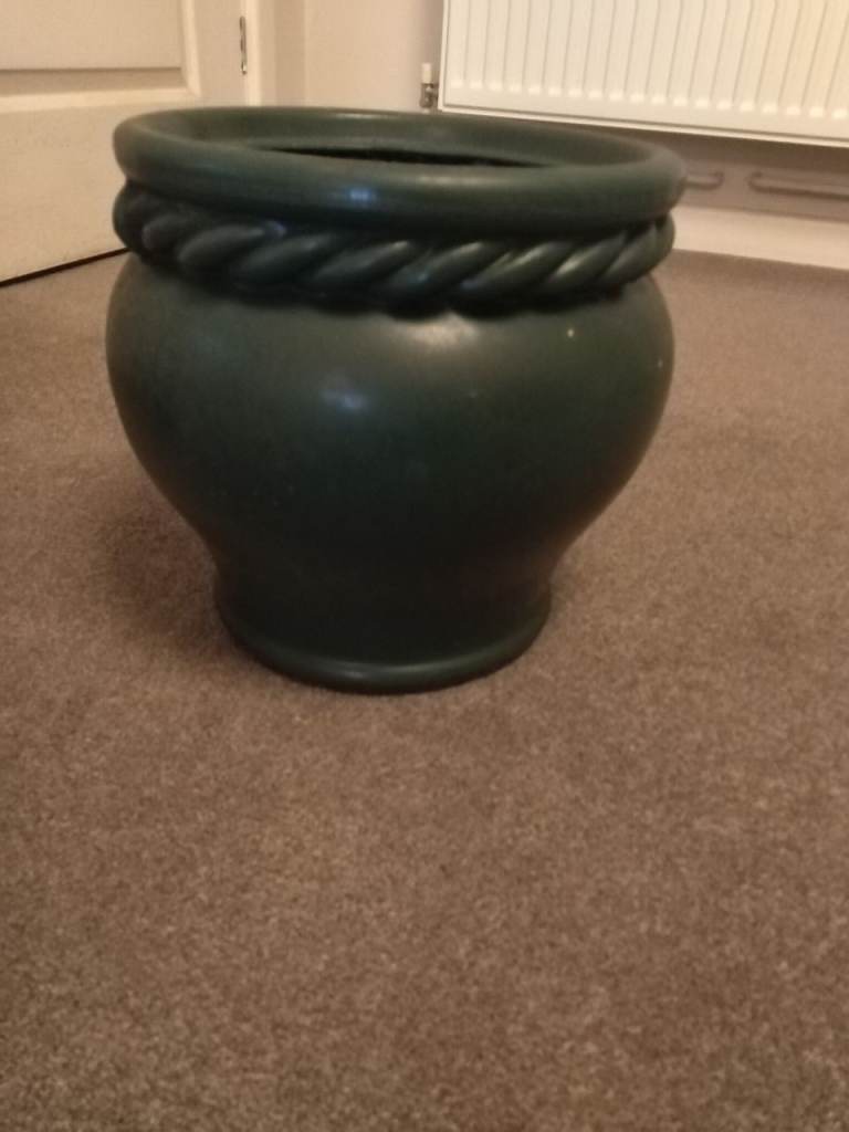 Green plastic plant pot 