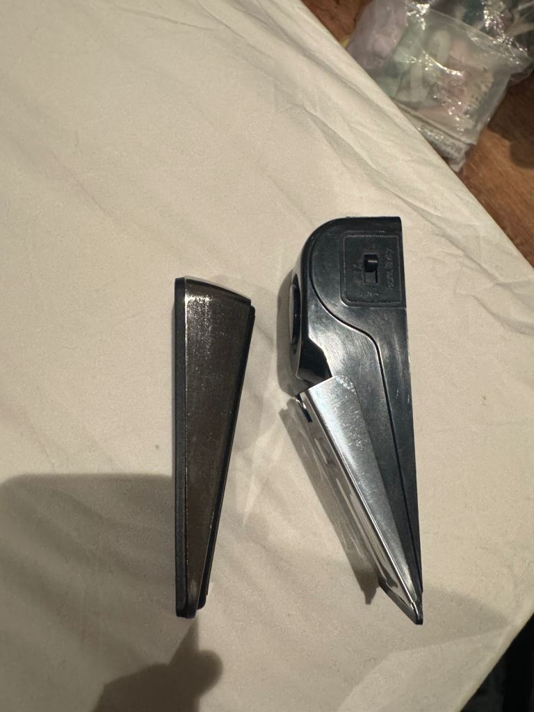 2 door stops (one metal one plastic electric door alarm) 