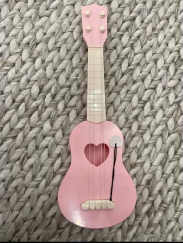 Children's pink toy guitar. 17 inches