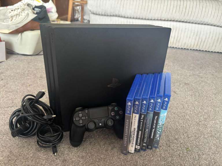 PlayStation 4 Console with Controller, Cables, and Games