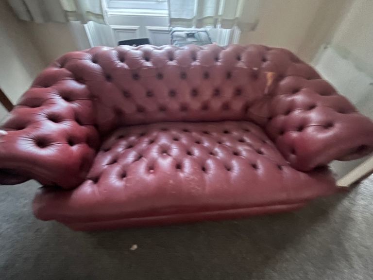 Damaged chesterfield sofa 