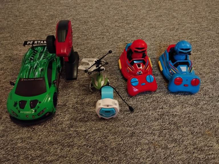 remote-controlled cars and a helicopter on the controls 