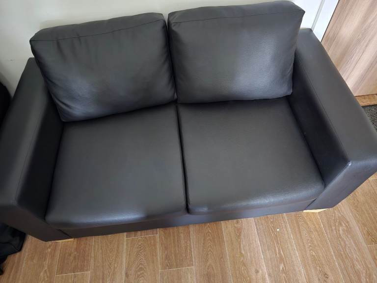 Two seater faux leather sofa for sale.  Price as advertised or nearest offer.