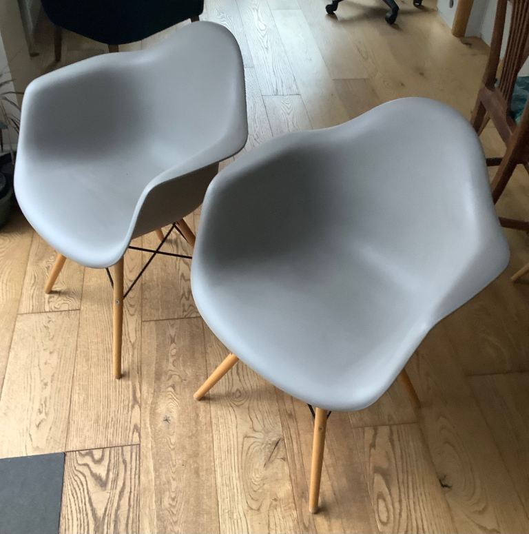 Dining chairs. Pair of Eames style carver chairs