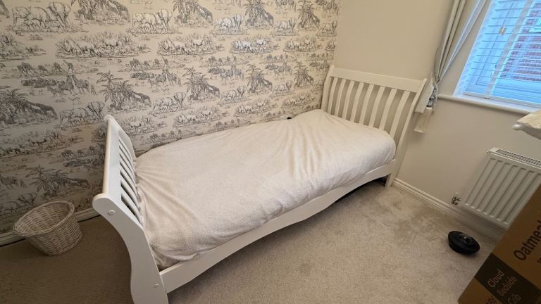 Single white bed and mattress 
