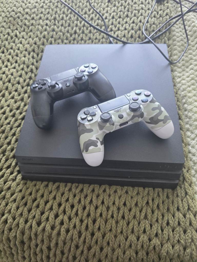 Sony PlayStation 4 Pro Console with Two Controllers