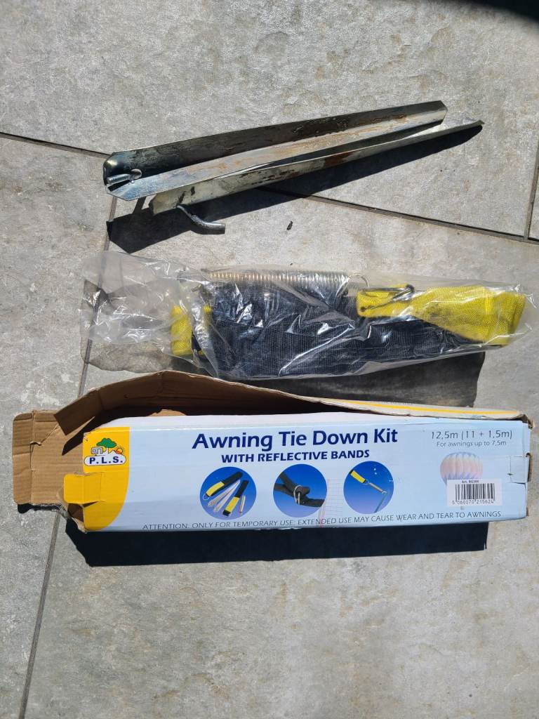 Universal Awning Tie Down Set. Used Once, still in box.