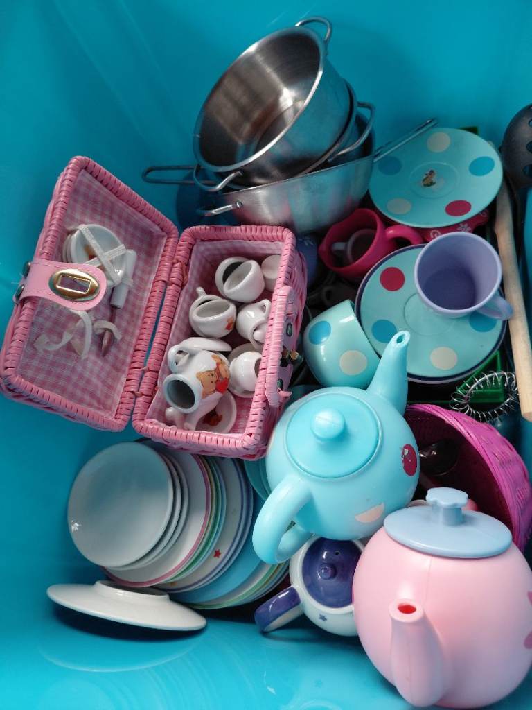 Box of play tea sets and cooking utensils