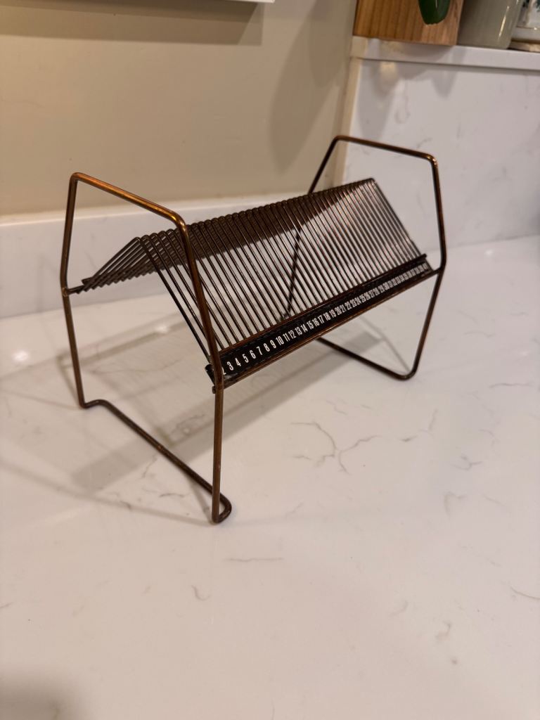 A vintage bronze brass finish 7” record holder 