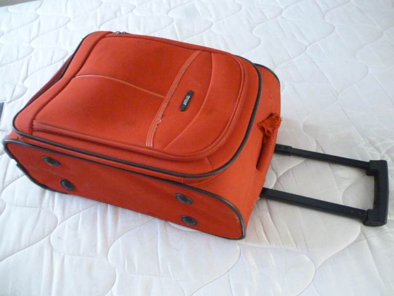 Very beautiful quality red cabin bag on wheels in very good condition (50 cms by 36 cms)