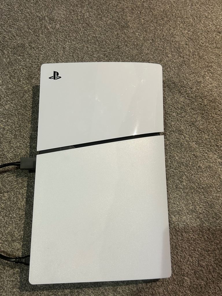 PlayStation 5, complete with 2 wireless controllers and charging dock station