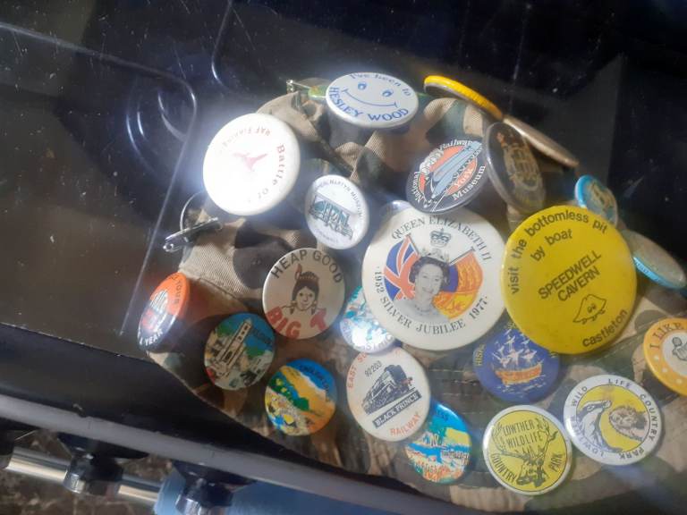 Hat with pin badges