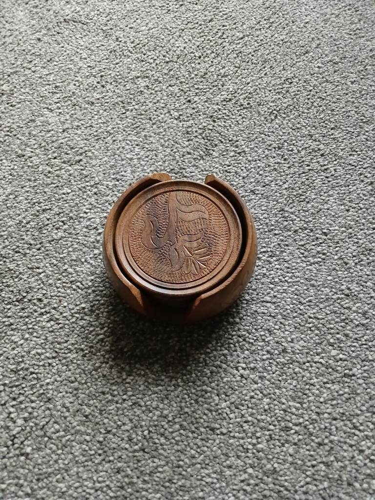 Wooden coasters in wooden holder