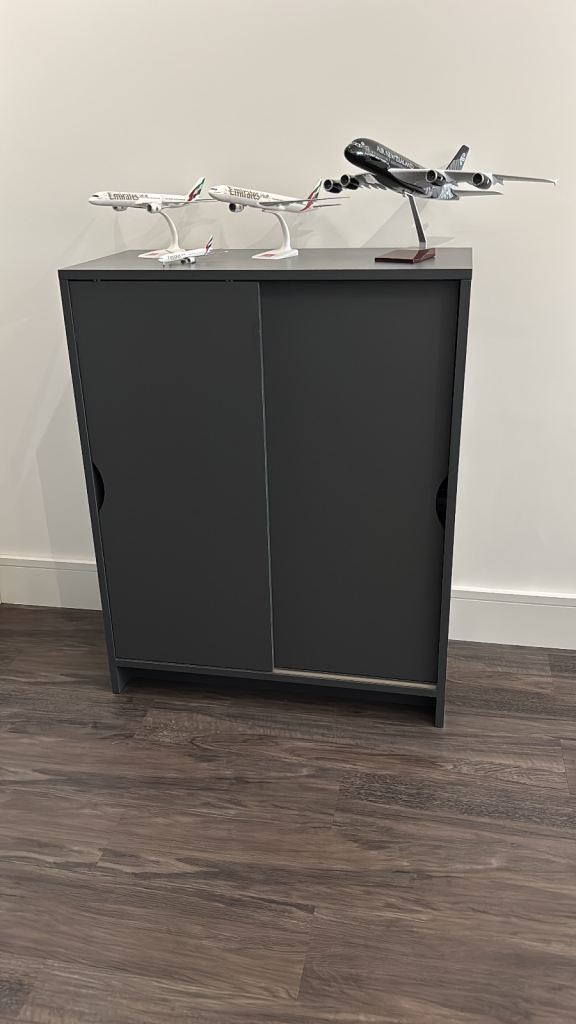 Compact Grey Storage Cabinet with Sliding Doors – Good Condition