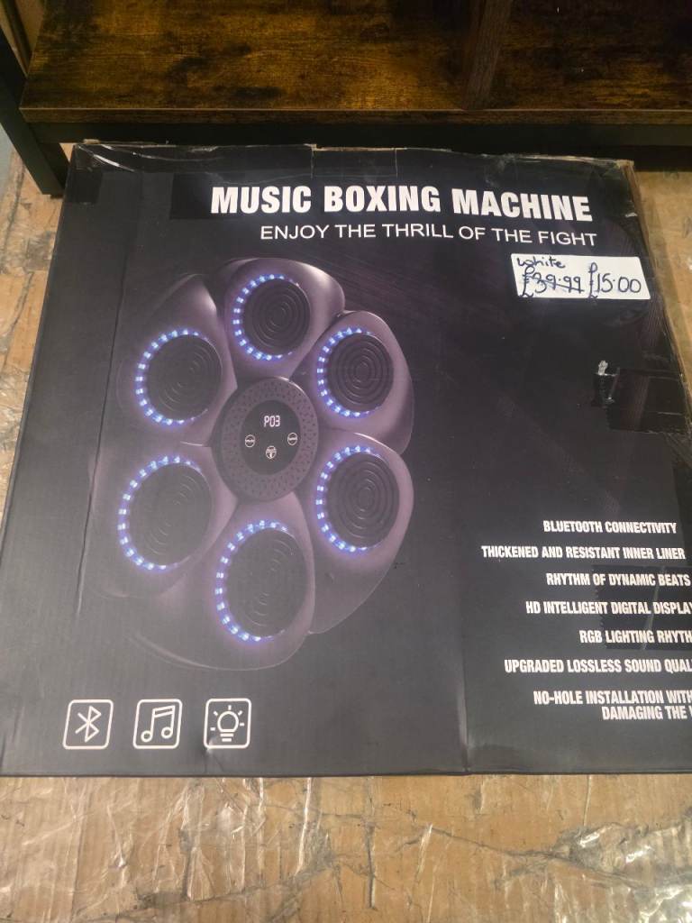 A new boxed white music boxing machine. 