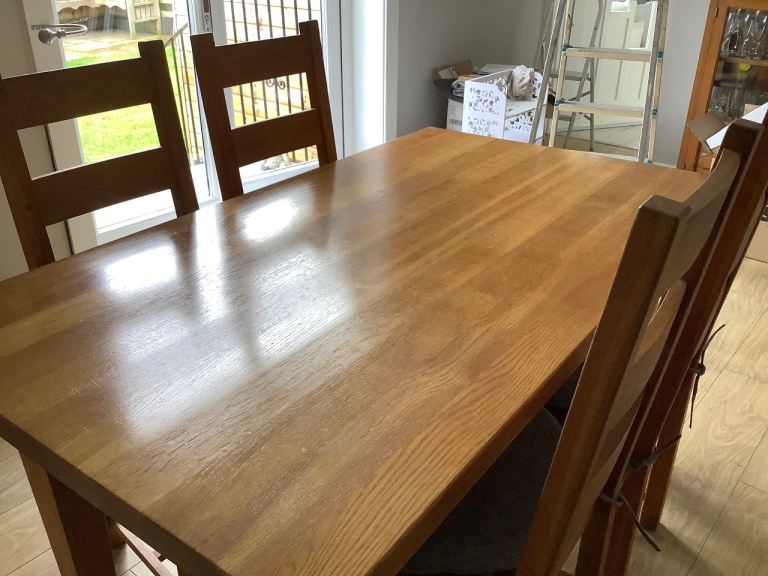 Solid Wood Dining Table with 4 Matching Chairs – Good Condition