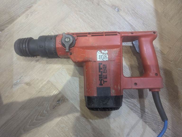 Reliable Hilti TE52 Breaker Drill comes with large drill bits  and case