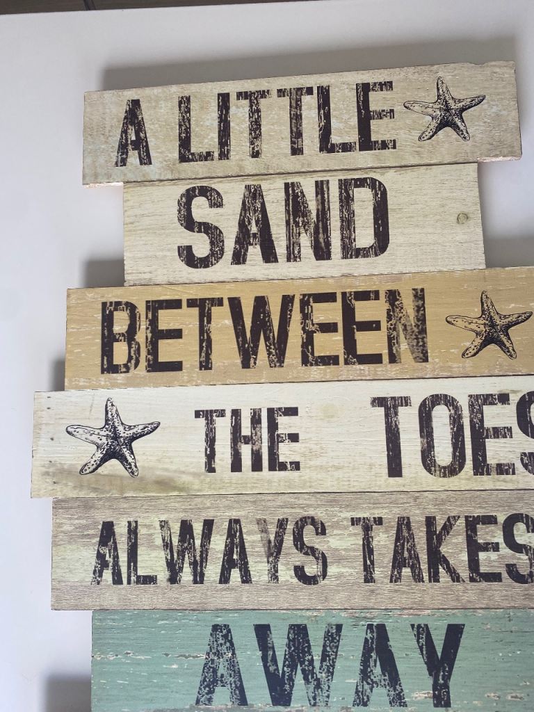 Wooden coastal driftwood sign