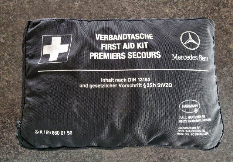 Mercedes first aid kit and wheel bag.