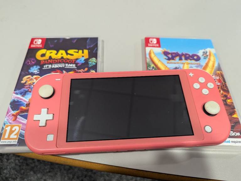 image for Nintendo switch lite coral pink with 2 games 