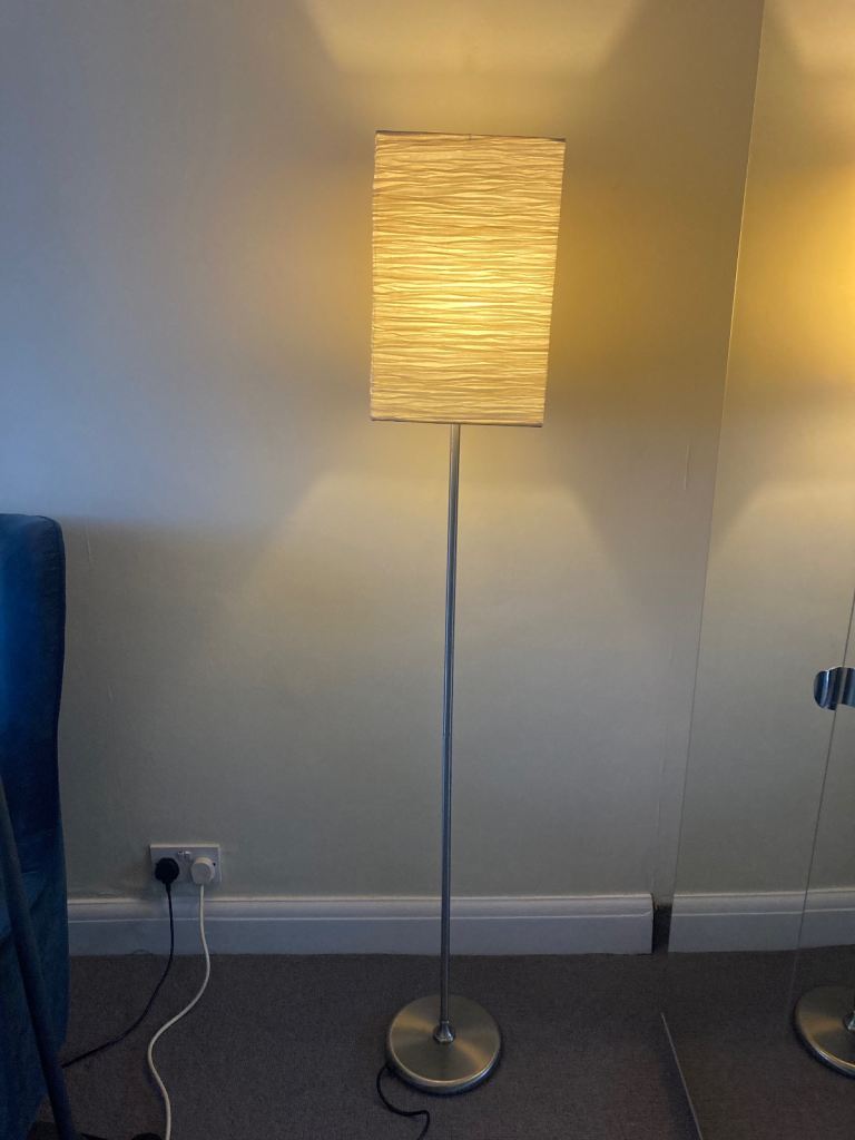 Tall stainless steel floor lamp with foot switch