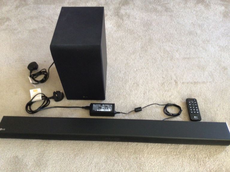 LG soundbar, subwoofer and remote control