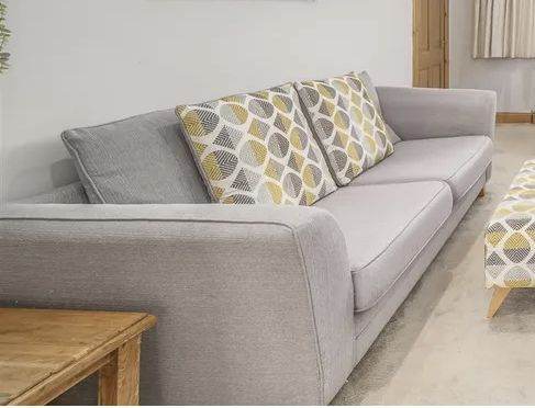 Comfortable Grey Fabric Sofa with Patterned Cushions