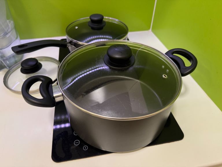 Set of Two Black Pots with Glass Lids – Good Condition
