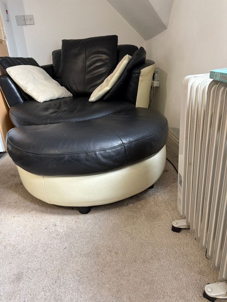 Leather swivel chair, including footstool with suede and leather cushions
