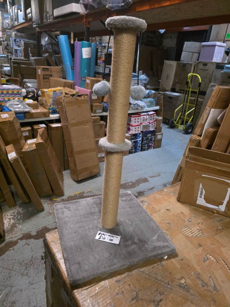 A new cat scratching post it is 74cms hight with 2 pom pom balls it 