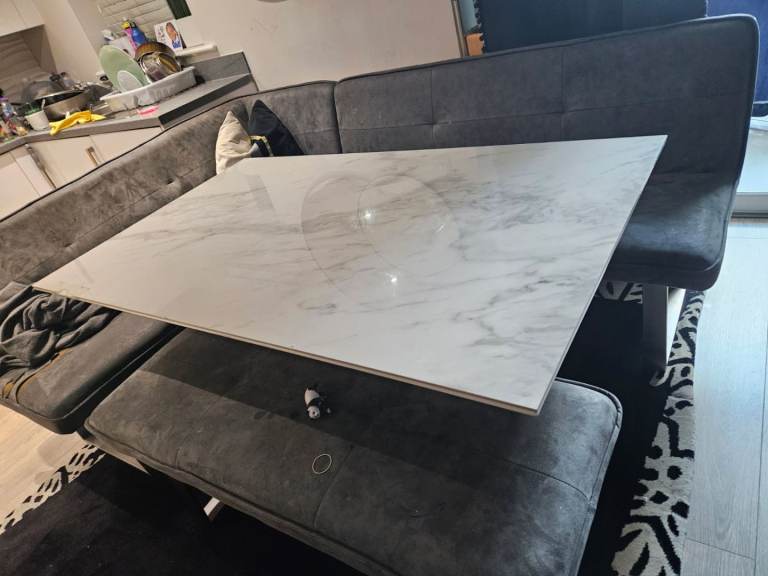 Table with corner chair, sofa and bench