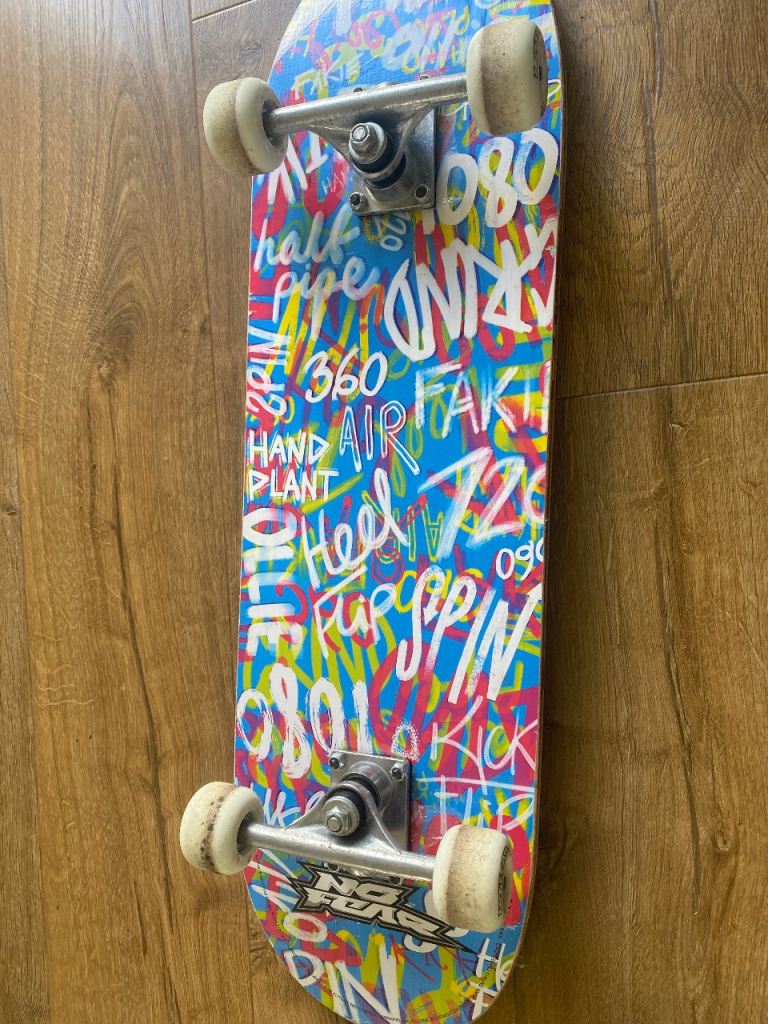 No Fear Skateboard with Graffiti Design – Good Condition