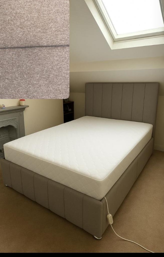 image for One week old double 4 ft6”  taupe fabric bed and pocket sprung mattress like brand new