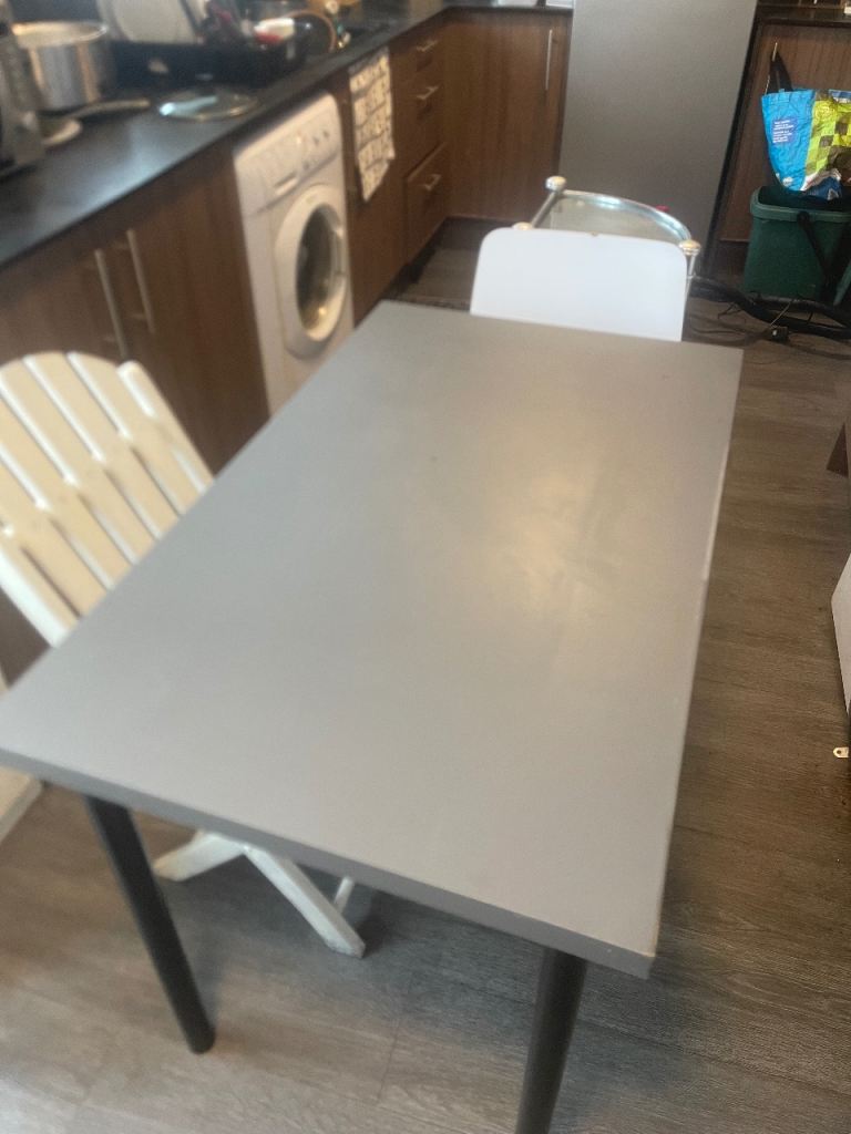 Grey Dining Table with Black Legs – Good Condition