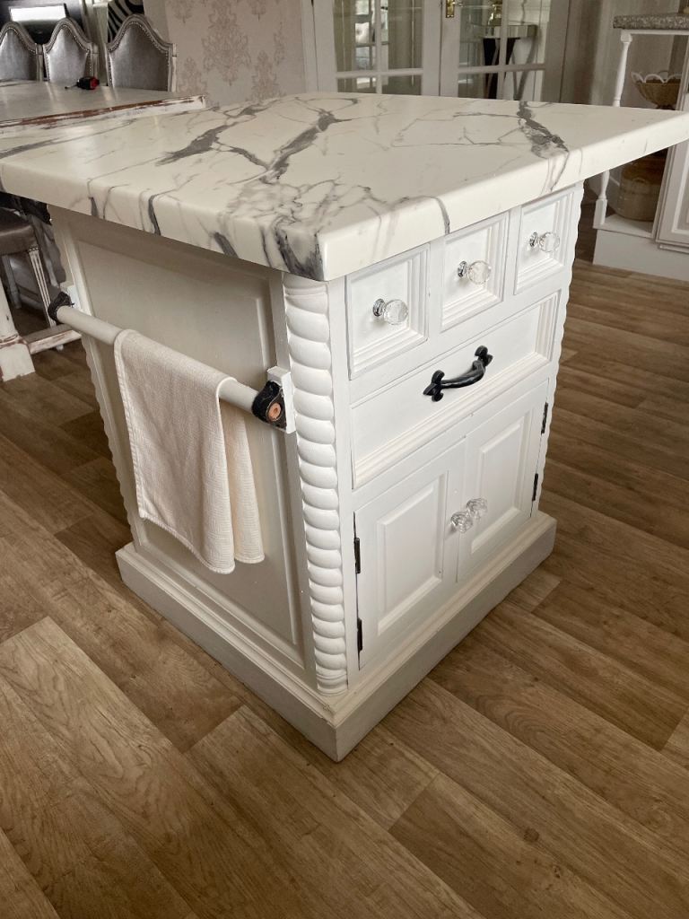 White painted compact Kitchen Island with faux Marble Top and Storage