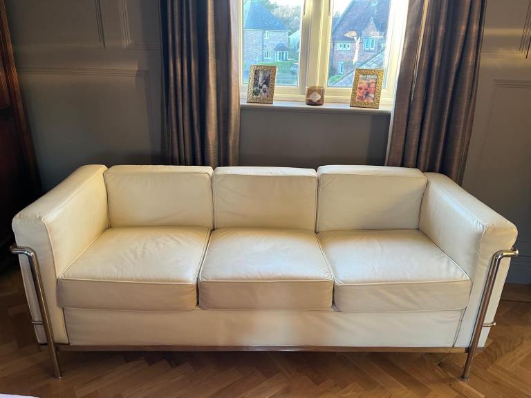 Cream leather three seater sofa. Cubed leather in chrome frame. 