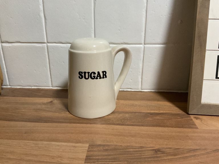 Vintage white sugar pourer