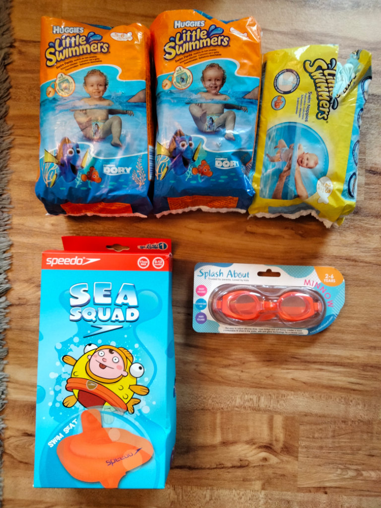 Speedo Swim Seat, Minnow Goggles and Huggies Little Swimmers Nappies and Pants.