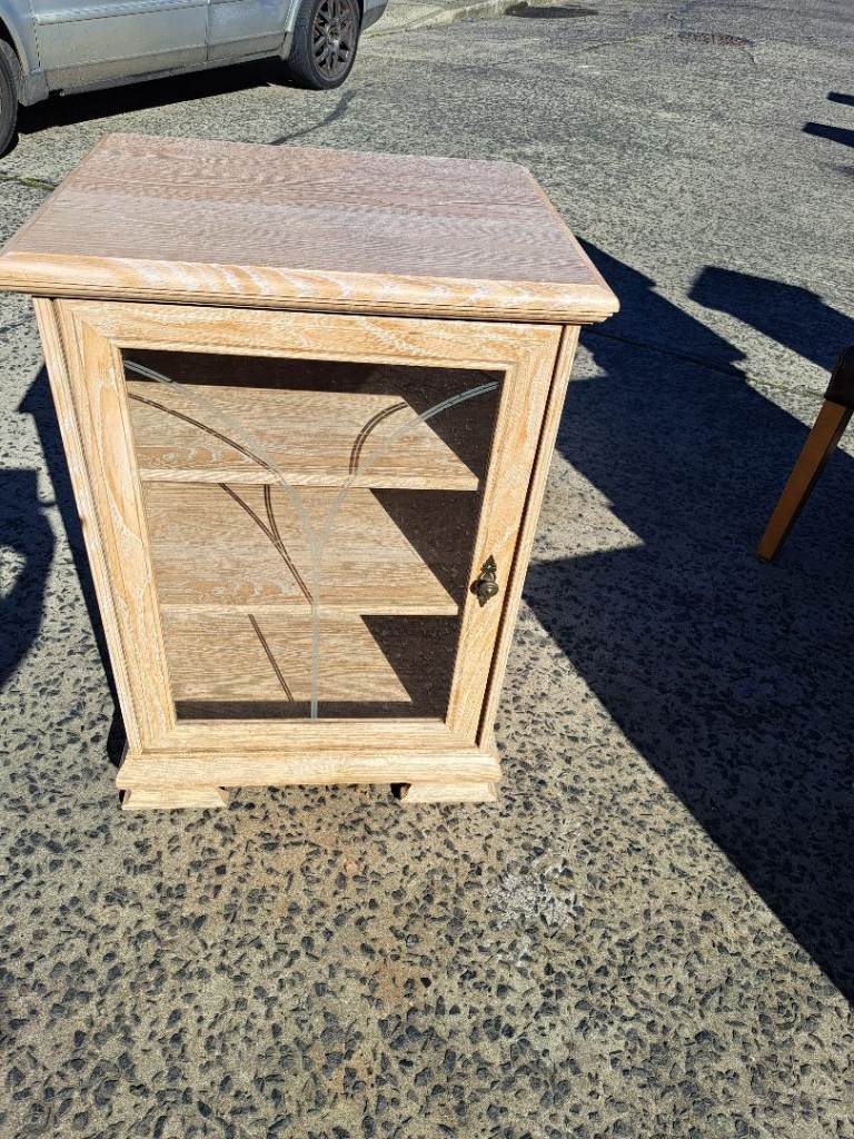 2 shelve light wood unit with glass door and lift up top