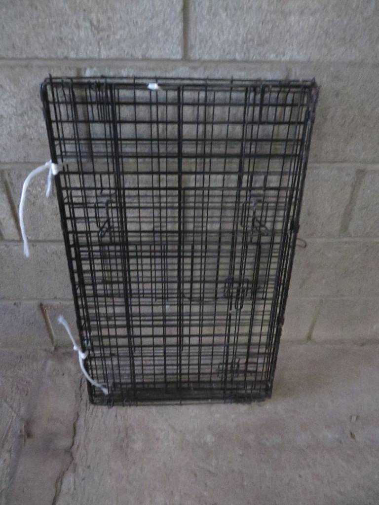 DOG CRATE IN VERY GOOD USED CONDITION.