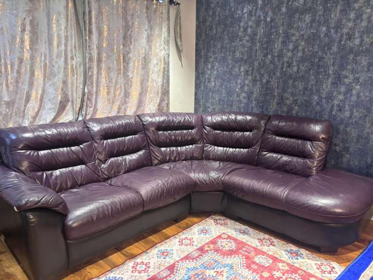 Lovely leather sofa and round spinning chair with foot rest
