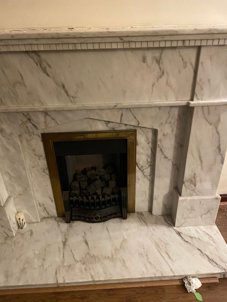 Large marble fireplace and gas fire