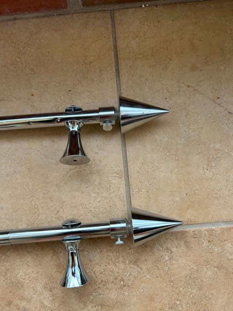 Two pairs of Chrome Extendable Curtain Poles with Brackets extends from 150-250cm