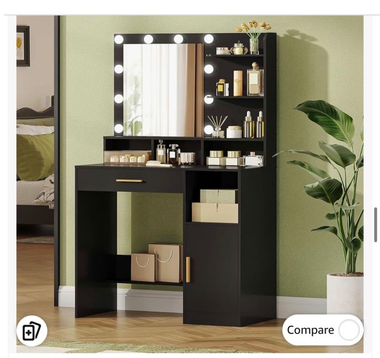 Black vanity with mirror and bulbs