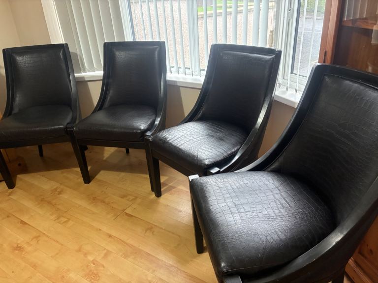 Four black chairs 