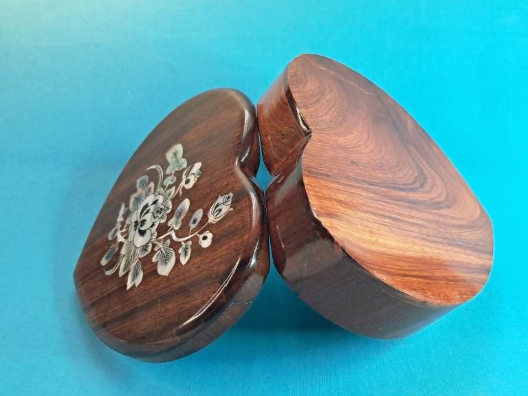 Vintage heart-shaped wooden jewelry box with a red velvet interior.  As seen