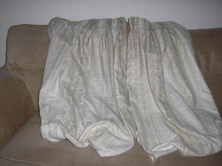 Pair of curtains with tie backs from pet & smoke free home. 