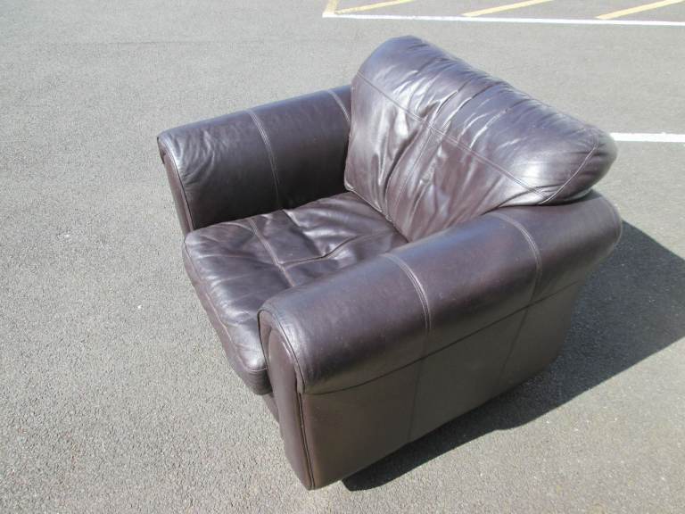 SINGLE DARK BROWN LEATHER ARMCHAIR at HAVEN TRUST CHARITY SHOP
