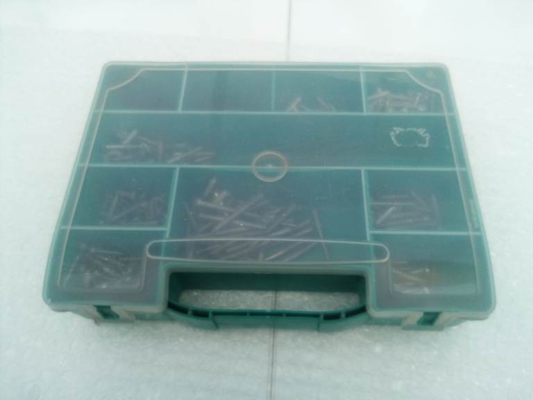 Storage box with individual compartments, with assorted screws. Tools